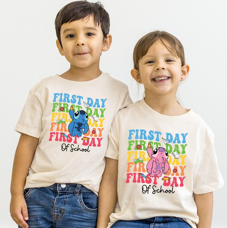a couple of kids standing next to each other