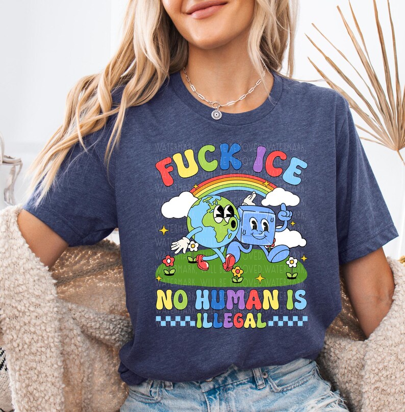 a woman wearing a t - shirt that says fucking ice, no human is illegal
