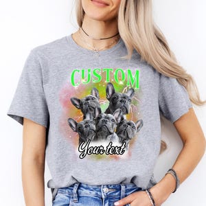 a woman wearing a t - shirt with three dogs on it