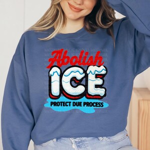 a woman wearing a blue sweatshirt with an ice logo