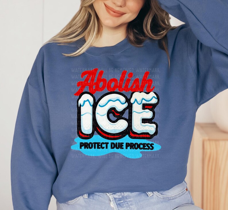a woman wearing a blue sweatshirt with an ice logo