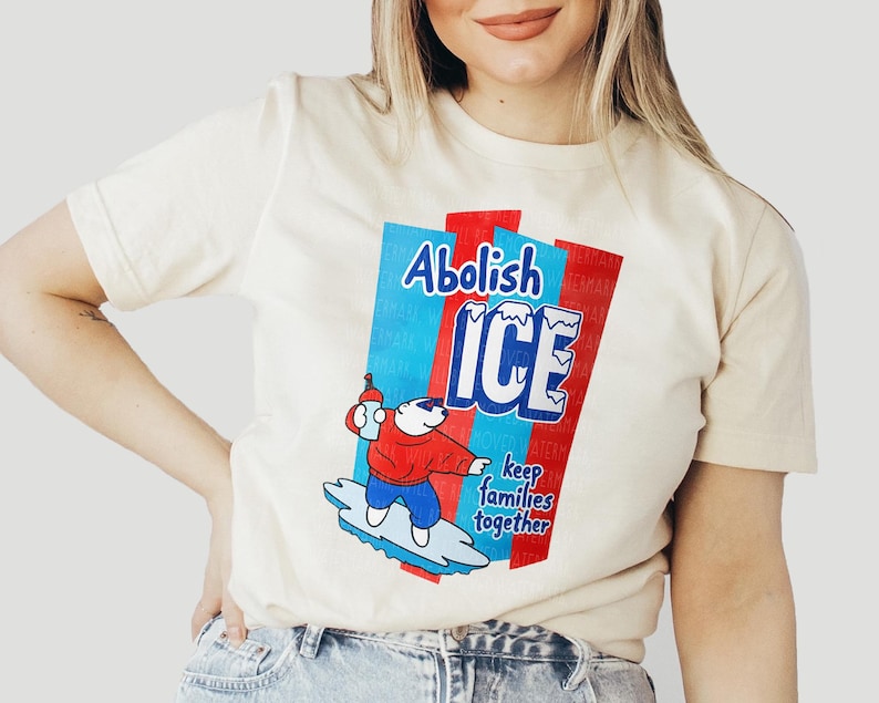 a woman wearing a t - shirt with a cartoon character on it