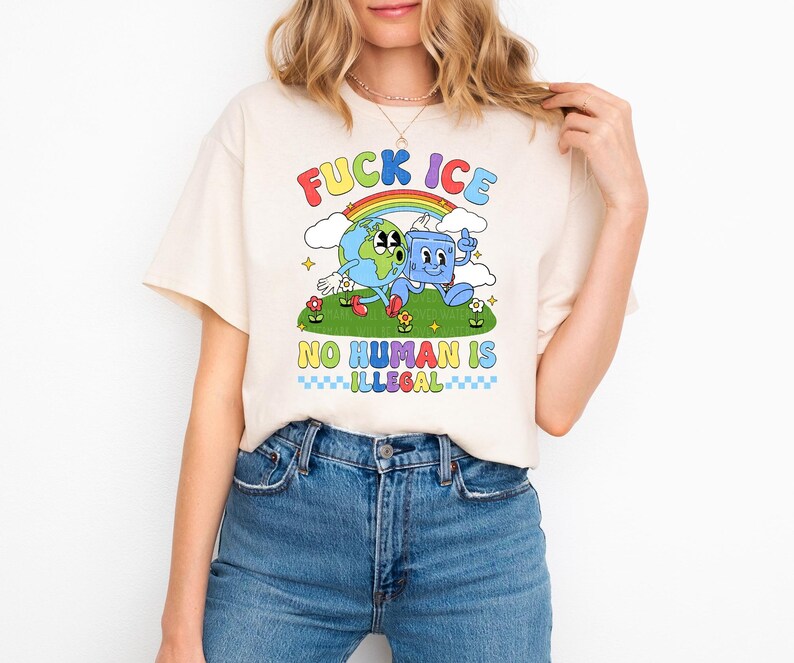 a woman wearing a t - shirt with a cartoon character on it