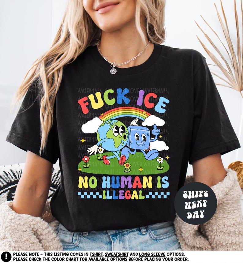 a woman wearing a black t - shirt with a cartoon character on it