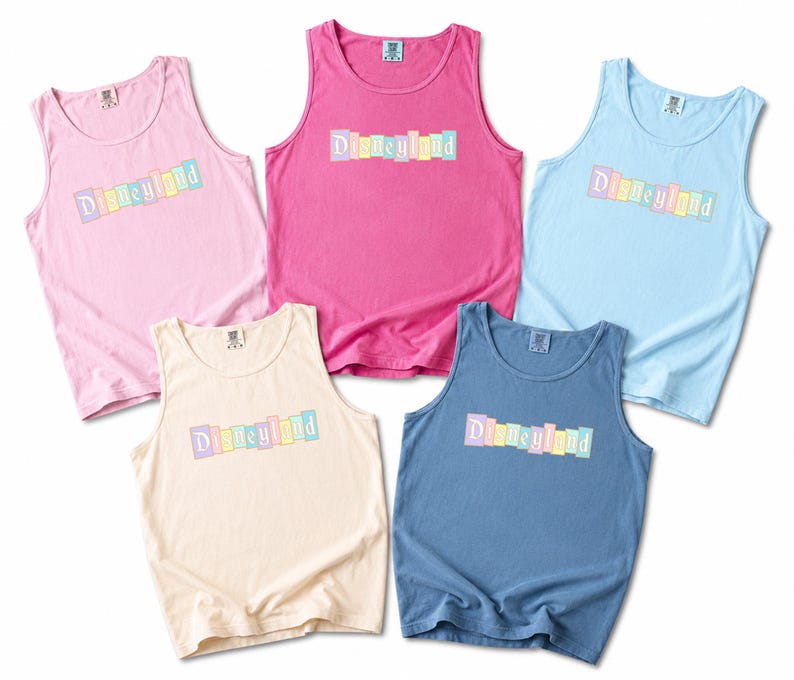a collection of five colorful tank tops, each with the word "Disneyland" printed on them.