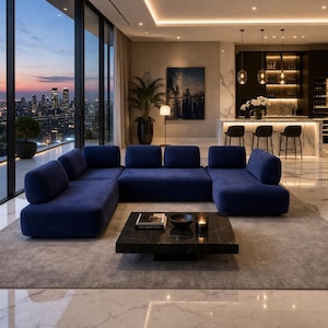 May include: A modern living room with a U-shaped navy blue sofa, a black marble coffee table, and a city skyline view through large windows. The room features a bar area with stools and pendant lights.