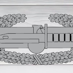 May include: A silver military badge with a knife and grenade design, surrounded by two oak leaf wreaths.