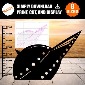 May include: A black silhouette of a stylized, pointed, curved shape with circular cutouts, accompanied by a grid-based template diagram and a vertical measuring scale marked in feet from 1 to 8. Text reads MATOY, SIMPLY DOWNLOAD, PRINT, CUT, AND DISPLAY.