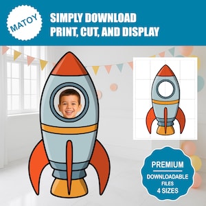 May include: A large, cartoon-style rocket ship with a child's face in the window. The rocket is primarily light blue, with orange and yellow accents. Text reads "SIMPLY DOWNLOAD, PRINT, CUT, AND DISPLAY". A smaller, cut-out rocket is also shown.