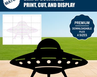 May include: A black UFO silhouette with three legs and a series of lights. The image includes the text "SIMPLY DOWNLOAD PRINT, CUT, AND DISPLAY" and "PREMIUM DOWNLOADABLE FILES 4 SIZES". A grid with a UFO outline is also present.