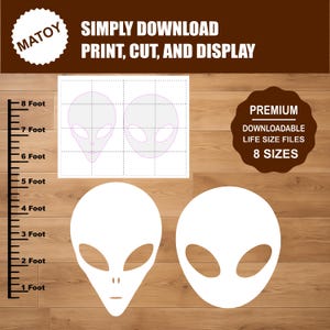 May include: A digital template for alien head cutouts featuring two distinct head shapes with large oval eyes. The graphic includes text reading MATOY, SIMPLY DOWNLOAD PRINT, CUT, AND DISPLAY, and PREMIUM DOWNLOADABLE LIFE SIZE FILES 8 SIZES, with a ruler showing 8 feet.