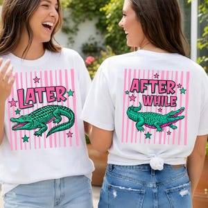 May include: White t-shirts with a pink striped background and a green alligator graphic. One shirt says "LATER" and the other says "AFTER WHILE" in pink text. Both shirts have star accents.
