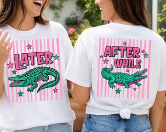 May include: White t-shirts with a pink striped background and a green alligator graphic. One shirt says "LATER" and the other says "AFTER WHILE" in pink text. Both shirts have star accents.