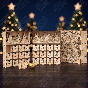 May include: A light-coloured wooden Christmas advent calendar with twenty-four numbered drawers. The top panels feature laser-cut winter scenes with a snowman and Santa in a sleigh. The right panel displays the text Merry Christmas in ornate script.