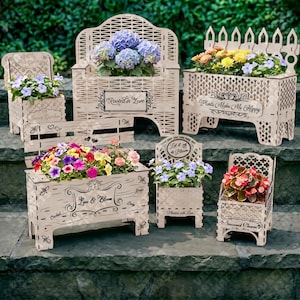 May include: A collection of wooden planters in various shapes and sizes, filled with colorful flowers. The planters feature decorative cut-out designs and text such as "Rooted in Love" and "Plants Make Me Happy".