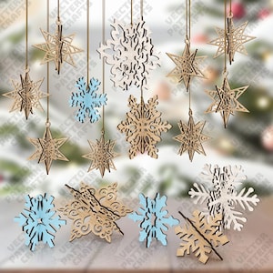 May include: A collection of wooden snowflake and star ornaments in various designs, suspended by strings. Some are natural wood, others are painted light blue. These decorative pieces are ideal for holiday or winter-themed decor.