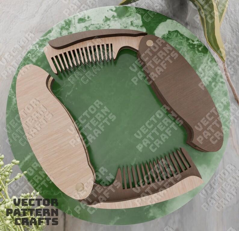 May include: A wooden comb with a folding handle. The comb is made of two pieces of wood, one light brown and one dark brown. The comb is closed and the handle is folded. The comb is on a green background.