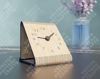 May include: A wooden clock with a simple design. The clock face is made of light wood with black numbers and hands. The clock is sitting on a dark surface.