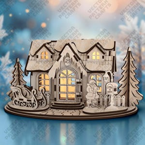 May include: A wooden Christmas village scene with a house, sleigh, and Santa Claus figure. The house has lit windows and a door with the number 25. A sign reads "Letters to Santa".