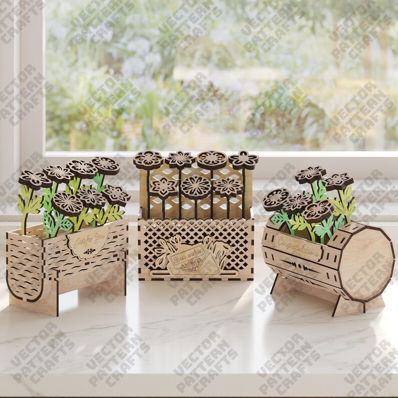 May include: Three wooden flower boxes with laser-cut designs. Each box holds decorative flowers with dark brown petals and green leaves. One box reads "Just for You," another "Best wishes," and the third "Congratulations."