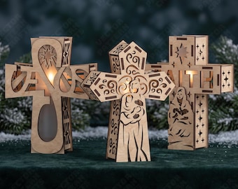 May include: Three light-colored wooden cross-shaped candle holders with intricate laser-cut designs. The left cross features the word Jesus, the center cross depicts a figure holding a child, and the right cross displays the word Faith with a star.