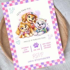 May include: A 5x7 inch rectangular birthday invitation card featuring a pink and purple checkered border. The center displays three cartoon puppies with text reading LETS PAW-TY, HALLIE IS TURNING TWO, and details for date, time, location, and RSVP contact.