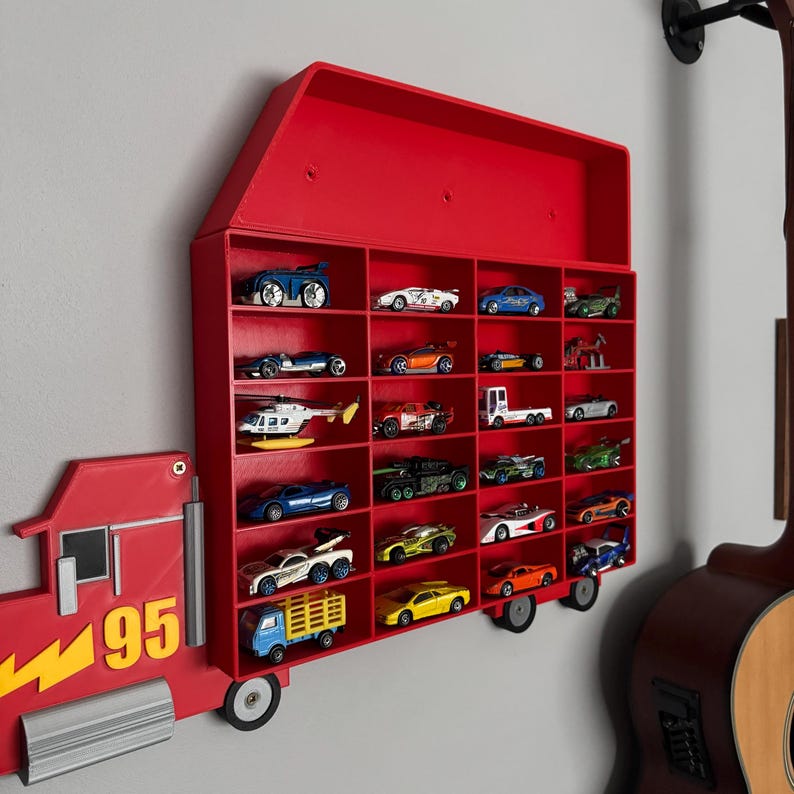 May include: Red toy truck wall shelf with a red roof and 24 slots for toy cars. The truck has the number 95 on the side.