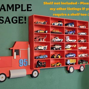 Red truck with wheels displayed around a red shelf, showcasing an example usage. Shelf not included, truck and wheels designed to fit custom shelving or other creative uses.