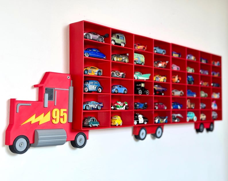 Red Disney-inspired toy car storage truck with shelving, perfect for holding Hot Wheels or Matchbox cars. This fun practical display is a great way to organise a child’s room while encouraging creativity and play. Available in customisable colours.