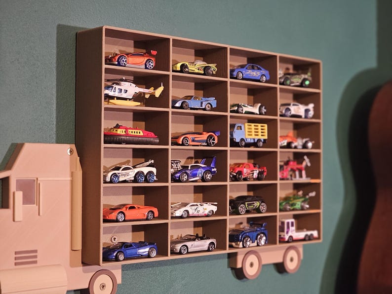 3D-printed truck-themed wall shelf with wooden finish PLA, designed for car storage. Ideal for adult and child car collectors to organise and display collectables neatly in 24 compartments. Oak and Pine effect colour