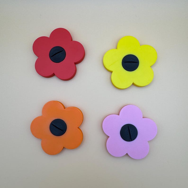 A selection of flower shaped floral place card holders, 3d printed. Perfect for weddings or restaurants that want a unique personalised event or wedding. For holding cards such as 'groom' 'bride' etc. Choice of colours available