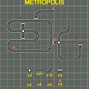 May include: A diagram of a city road network labeled "METROPOLIS" in yellow. The network includes roads, intersections, traffic lights, and stop signs. Various road pieces and accessories are shown below the network.