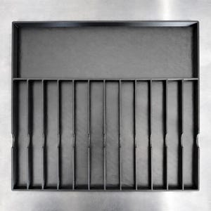 May include: A dark gray organizer tray with a rectangular shape. The tray has a large upper compartment and a lower section divided into 12 narrow vertical slots. The surface has a textured appearance.