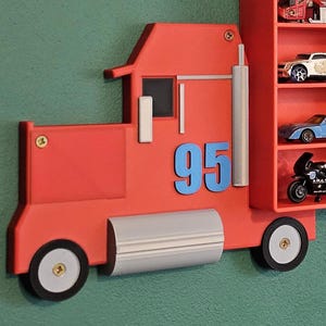 Vibrant red truck with iconic “95” design inspired by Disney Cars. Adds charm and realism to any Hot Wheels or Matchbox display. Perfect for fans and collectors seeking creative, tidy organisation for shelves.