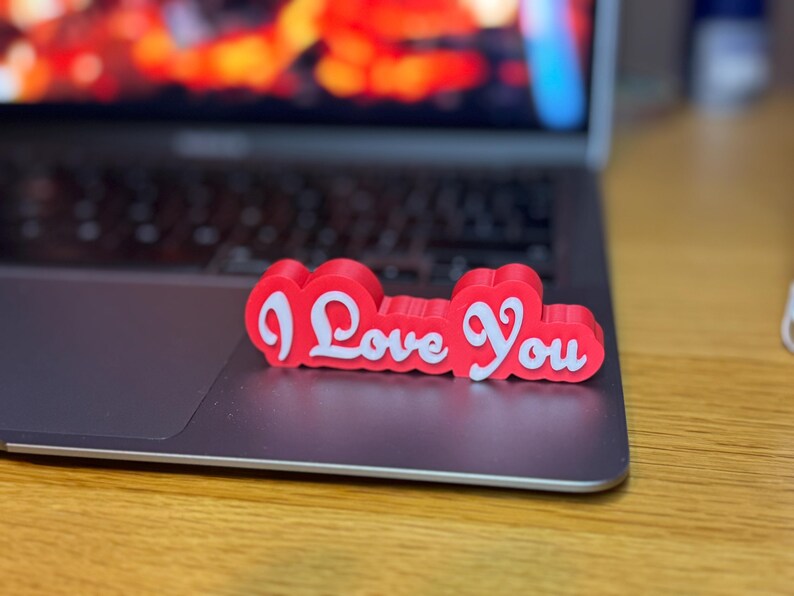 3D printed ‘I Love You’ sign with bold red and white 3D letters. A perfect Valentine’s Day gift, romantic decor, or anniversary present. Unique, high-quality design makes it ideal for bedroom decor, couples’ gifts, or special celebrations of love.