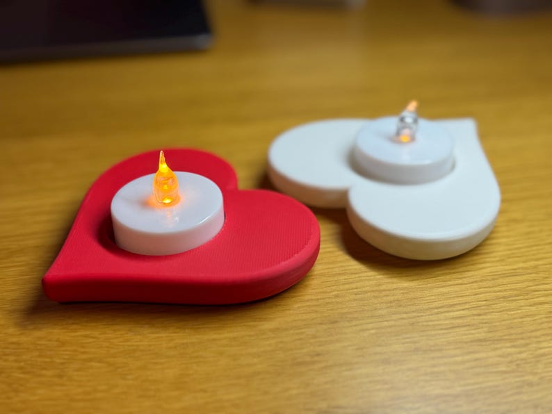 3D printed heart-shaped tealight holder with smooth, realistic, rounded edges. Perfect for LED or real flame candles. Available in various colours and pack sizes. Ideal for Valentine’s Day, romantic gifts, anniversaries, or cosy home decor.