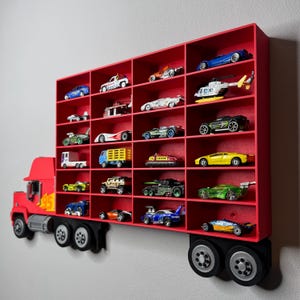 May include: A red, truck-shaped display shelf filled with various toy cars. The shelf has multiple compartments, each holding a different model of car, truck, and helicopter. The toy vehicles are in various colors and designs.