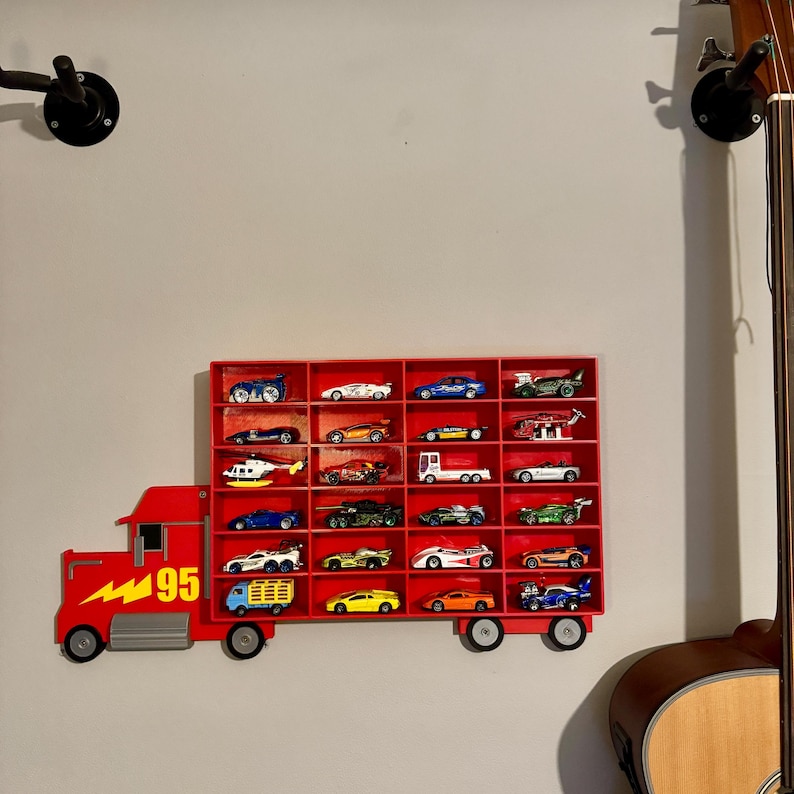 Red Disney-inspired toy car storage truck with shelving, perfect for holding Hot Wheels or Matchbox cars. This fun practical display is a great way to organise a child’s room while encouraging creativity and play. Available in customisable colours.