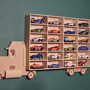 3D-printed truck-themed wall shelf with wooden finish PLA, designed for car storage. Ideal for adult and child car collectors to organise and display collectables neatly in 24 compartments. Available in Dark and Light wood colours