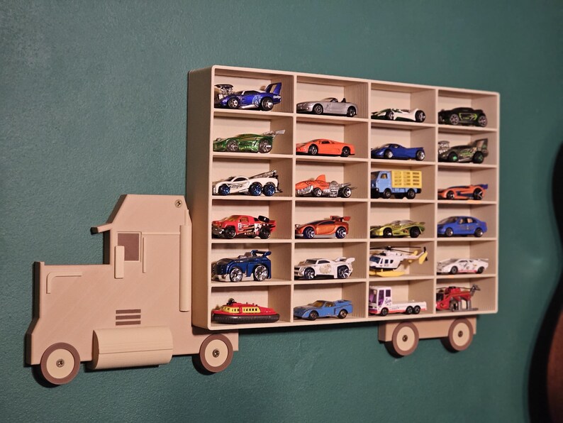 3D-printed truck-themed wall shelf with wooden finish PLA, designed for car storage. Ideal for adult and child car collectors to organise and display collectables neatly in 24 compartments. Available in Dark and Light wood colours