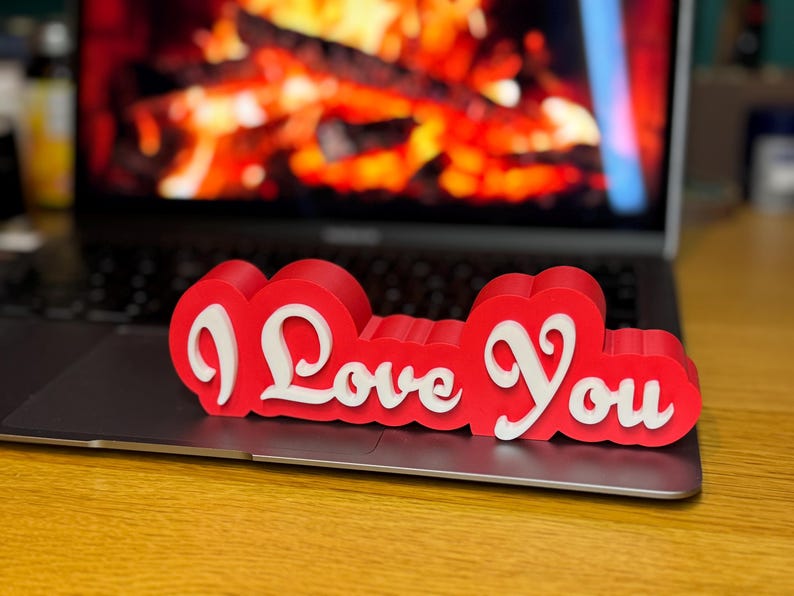 3D printed ‘I Love You’ sign with bold red and white 3D letters. A perfect Valentine’s Day gift, romantic decor, or anniversary present. Unique, high-quality design makes it ideal for bedroom decor, couples’ gifts, or special celebrations of love.