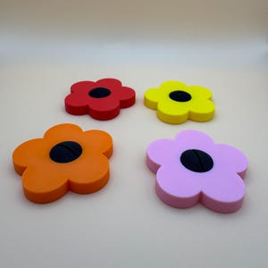 A selection of flower shaped floral place card holders, 3d printed. Perfect for weddings or restaurants that want a unique personalised event or wedding.