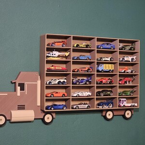 3D-printed truck-themed wall shelf with wooden finish PLA, designed for car storage. Ideal for adult and child car collectors to organise and display collectables neatly in 24 compartments. A functional decor piece that adds charm to any room.