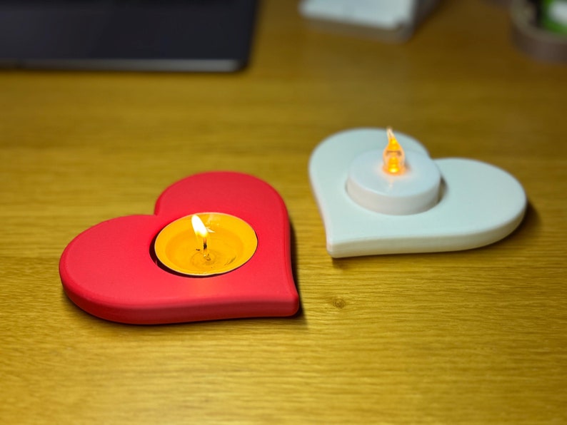 3D printed heart-shaped tealight holder with smooth, realistic, rounded edges. Perfect for LED or real flame candles. Available in various colours and pack sizes. Ideal for Valentine’s Day, romantic gifts, anniversaries, or cosy home decor.