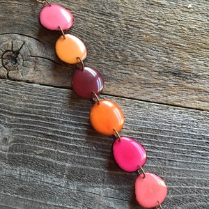 Bracelet in pinks, oranges, reds