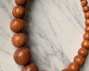 Graduated size round wood bead necklace