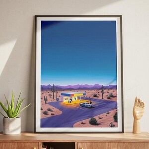 May include: A digital illustration of a desert landscape at night with a small building and a car in the parking lot. The building is yellow with blue and red accents. The sky is a deep blue with a few stars visible. The car is a blue sedan. The landscape is a mix of sand and cacti.