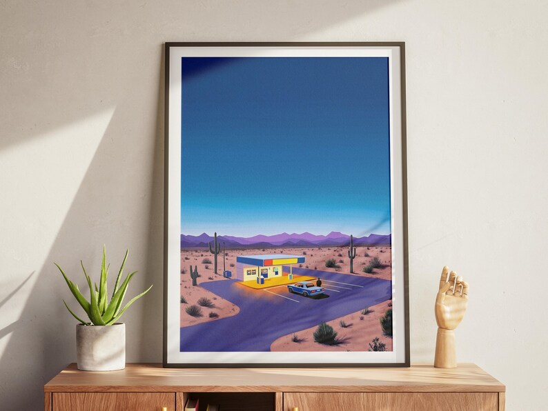 May include: A digital illustration of a desert landscape at night with a small building and a car in the parking lot. The building is yellow with blue and red accents. The sky is a deep blue with a few stars visible. The car is a blue sedan. The landscape is a mix of sand and cacti.