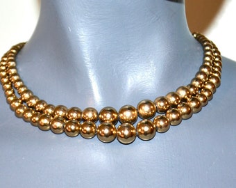 Vintage signed Monet Gold graduated beads double strand.  Signed.  VFG.  Choker. adjustable.