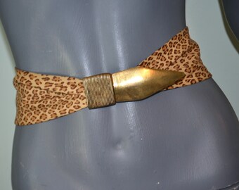 Vintage wide Animal Print leather belt with copper tone spear head style buckle.  VFG Reynold Mejer Metal Petals Studio. 31.5 or less.